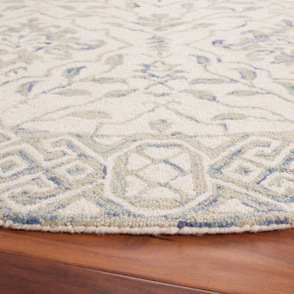 SAFAVIEH Handmade Dip Dye Elvedina Floral Wool Rug
