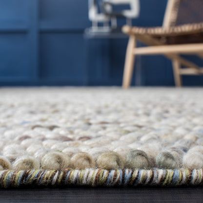 SAFAVIEH Handmade Natura Gonnie Wool Rug